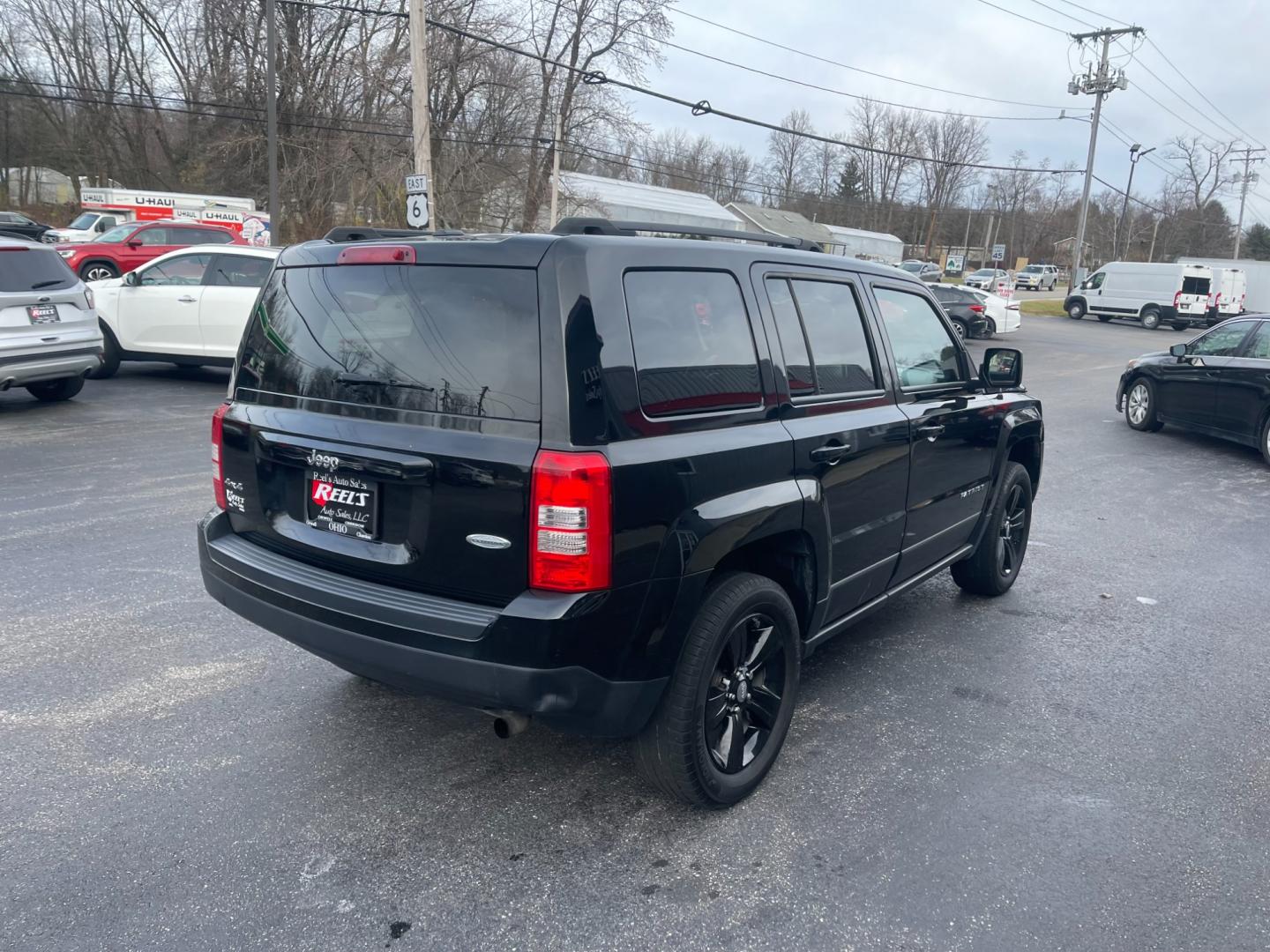 2017 Black /Black Jeep Patriot Latitude 4WD (1C4NJRFB5HD) with an 2.4L I4 DOHC 16V engine, 6-Speed Automatic transmission, located at 11115 Chardon Rd. , Chardon, OH, 44024, (440) 214-9705, 41.580246, -81.241943 - This 2017 Jeep Patriot Latitude with 4WD and only 55,000 miles on the odometer. This SUV comes equipped with a 2.4L engine for powerful performance. It features a comfortable and spacious interior with modern amenities. The 4WD capability ensures that you can handle any terrain or weather conditions - Photo#8